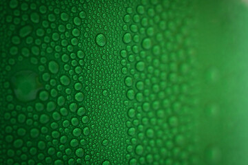 water drop on green beverage cans background, texture of cold aluminium package - obrazy, fototapety, plakaty