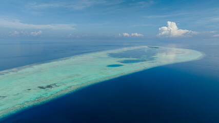 Tropical atoll and coral reef. Seascape with tropical island.Tun Sakaran Marine Park. Borneo, Sabah, Malaysia.