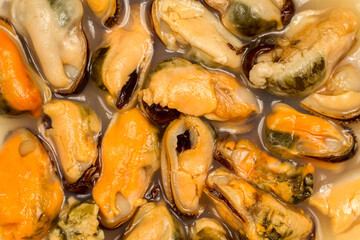 Mussels in brine. Mussel meat. Seafood close-up.