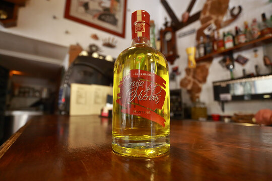 Bottle of Orujo Hierbas Montana. liquor. Orujo is an ancient Spanish pomace brandy, it is a transparent spirit with an alcohol content over 50%., aged with herbs and fruits.  06.04.2016. Mallorca
