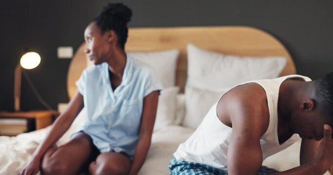 Black couple, fight and conflict in bedroom for frustrated argument, breakup and annoyed at home. Man, woman and partner crying with stress, crisis and drama of cheating, mistake or emotional anxiety