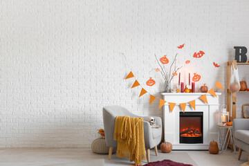 Interior of festive living room with fireplace and Halloween decor