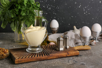 Gravy boat of fresh mayonnaise on table