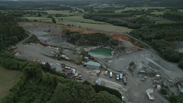 Aerial shot of Large quarry in Moeche, Galicia, Spain. Stripping extractive industry open pit mining.
