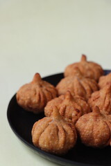 Modak- a traditional dish made during Ganpati festival in India, a sweet made with coconut, jaggery, and dry fruits stuffed inside the wheat dough