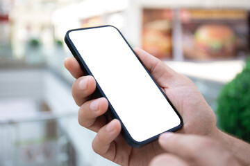 male hand holding phone with isolated screen background shopping center