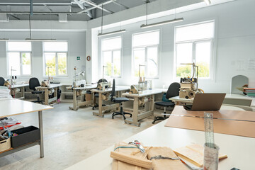 Interior of a sewing warehouse of furniture factory with equipment and materials