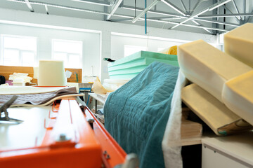 Stacked materials for furniture upholstery in furniture factory