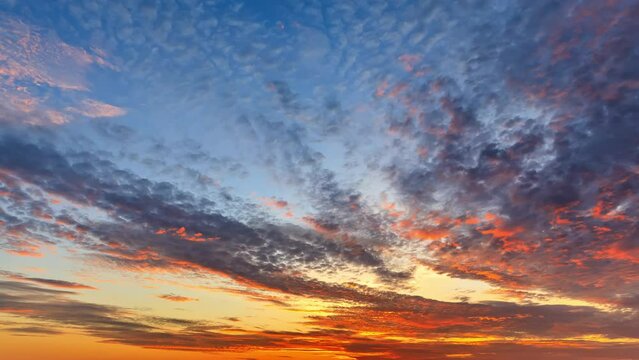 Colorful sky sunset clouds nature landscape. Red clouds change into yellow clouds. Sky clouds time lapse video.