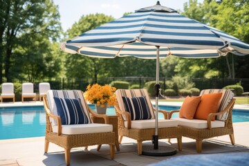 poolside umbrella matching a set of woven wicker chairs