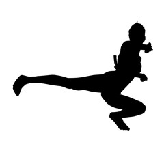 Fototapeta na wymiar Silhouette of a woman kicking pose. Silhouette of a female martial art in action pose.