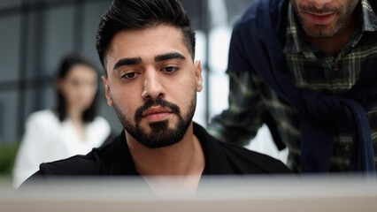 Businessman working on a laptop computer in the office