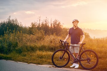 Obraz premium Man rides a bicycle. Into the Wilderness. Cycling Adventure in the Forest