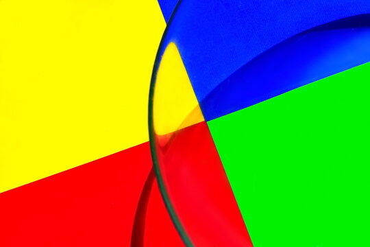 Abstract wallpaper. Geometric yellow, red, green, blue shapes with with shadow waves on surface