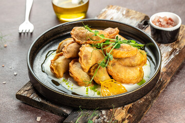 Varenyky, vareniki, pierogi, pyrohy, dumplings with filling, Food recipe background. Close up
