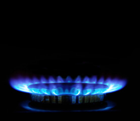 flames of gas stove in the dark