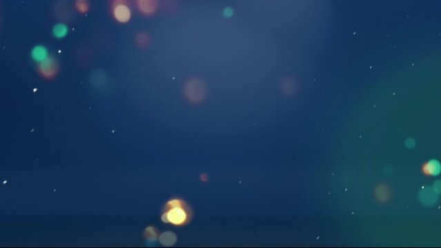 Christmas bokeh lights background with seamless snowing loop