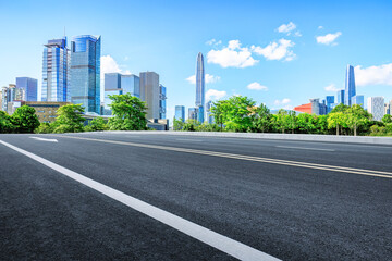 Fototapeta na wymiar Shenzhen city skyline and clean asphalt road background