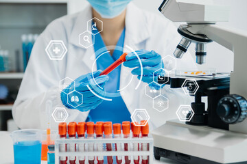 DNA molecule testing concepts. The doctor in a mask examines DNA molecules on the chemical...