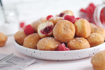 A plate wit traditional berliner cakes with jelly