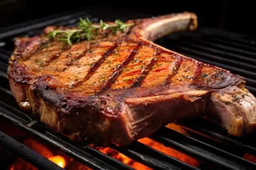 Gordijnen close shot of a t-bone steak with smoking grill marks © altitudevisual