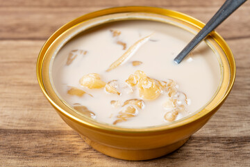angle view bowl of fish maw with milk