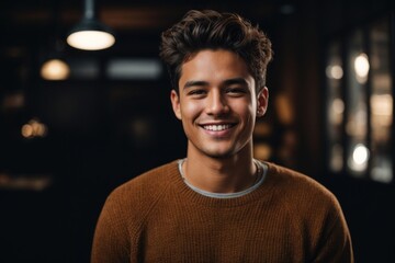 portrait of a handsome man smiling with mock up shirt and studio background