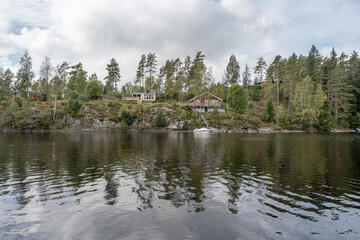 Lake Ragnerudssjoen in Dalsland Sweden beautiful nature forest pinetree swedish houses