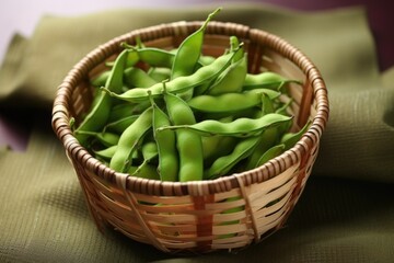 boiled edamame pods in woven bamboo basket