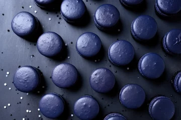 Fotobehang midnight blue macarons arranged in rows on a gray surface © Alfazet Chronicles