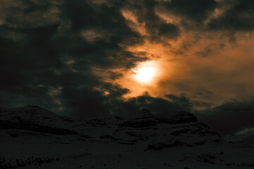 sunset in the snowy mountains. dramatic sky at sunset. sunset in the alps. sunset in winter. sunset over the mountains