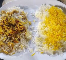 rice on a white plate in a restaurant, close-up. Iranian rice with vegetables and spices, Asian rice.