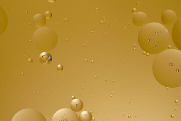 Abstract yellow background with oil circles water surface.