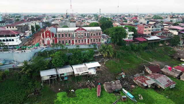 Aerial view of the Malecon Tarapaca Boulevard and the floating houses on Itaya river, Iquitos, Peru