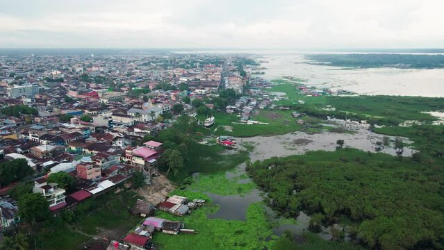 Aerial footage of the floating houses on the Itaya river and the cityscape of Iquitos, Peru