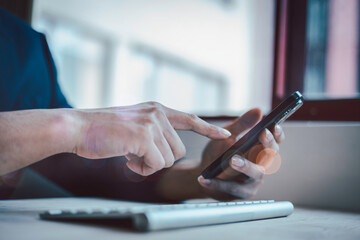 Social media marketing concept. hand using smartphone typing, chatting conversation in chat box icons pop up, Analyst working with Business, Analytics and Data Management System