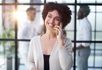 Businesswoman with phone in modern office