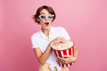 Portrait of impressed ecstatic woman wear stylish blouse in 3d glasses eat popcorn staring at movie...