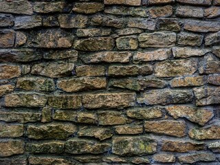 Mossy vintage stone wall texture