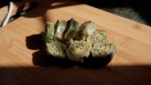 Alu Vadi, Patra, paatra, colocasia leaves roll, deep frying in oil. Patrode is a popular Indian healthy steamed snack.
