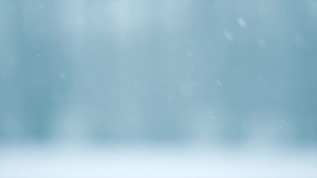 Winter abstract background with snow. Snowfall. Falling snow nature backdrop. Blurred winter backdrop with snow flakes on the wind. Outdoor Christmas scene. Slow motion. 