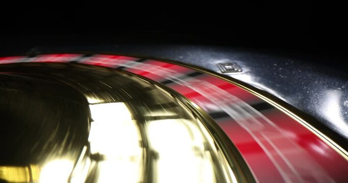 Have good game and play gambling. Closeup of roulette wheel in motion