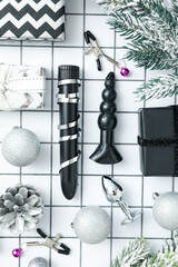 Sex toys with Christmas gifts on the background.