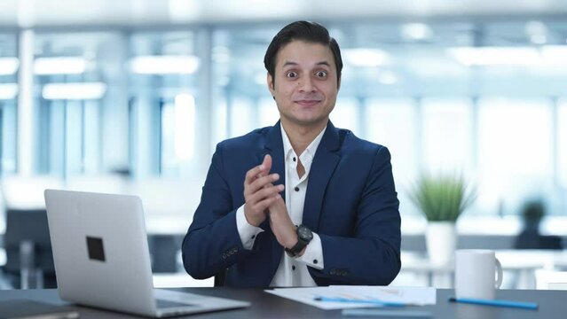 Happy Indian businessman clapping and appreciating