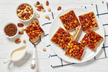 toffee mixed nuts shortbread bars on white plate