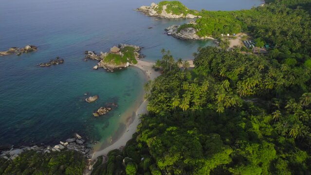 Tropical beach environment of Cabo San Juan in Tayrona National Park at sunset. Aerial
