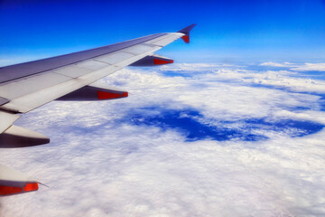 Fototapeta na wymiar Air WIng Over Clouds to NZ