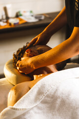 A man relaxes in a massage room for a facial massage. The concept of health and skin care