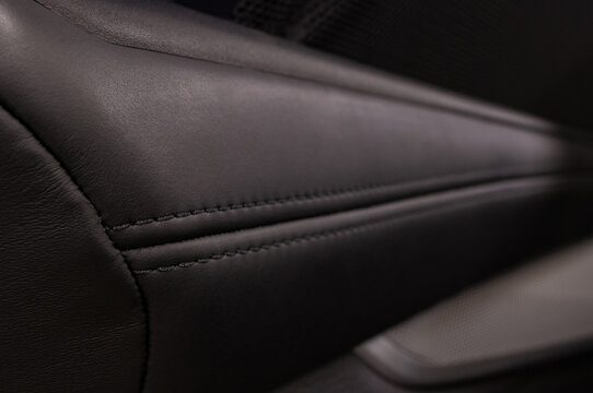 Abstract leather background. Car interior detail. Horizontal photo.