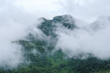 Fototapeta na wymiar Doi Luang Chiang Dao mountain hills in Chiang Mai, Thailand. Nature landscape in travel trips and vacations. mountain peak with mist and fog during rainy season
